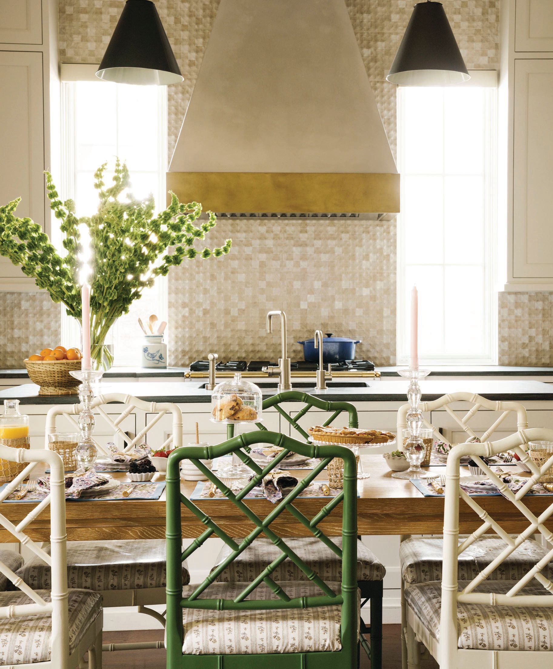The kitchen touts a colorful mix of patterns, bold textiles and fancy fixtures. PHOTOGRAPHED BY JACK THOMPSON